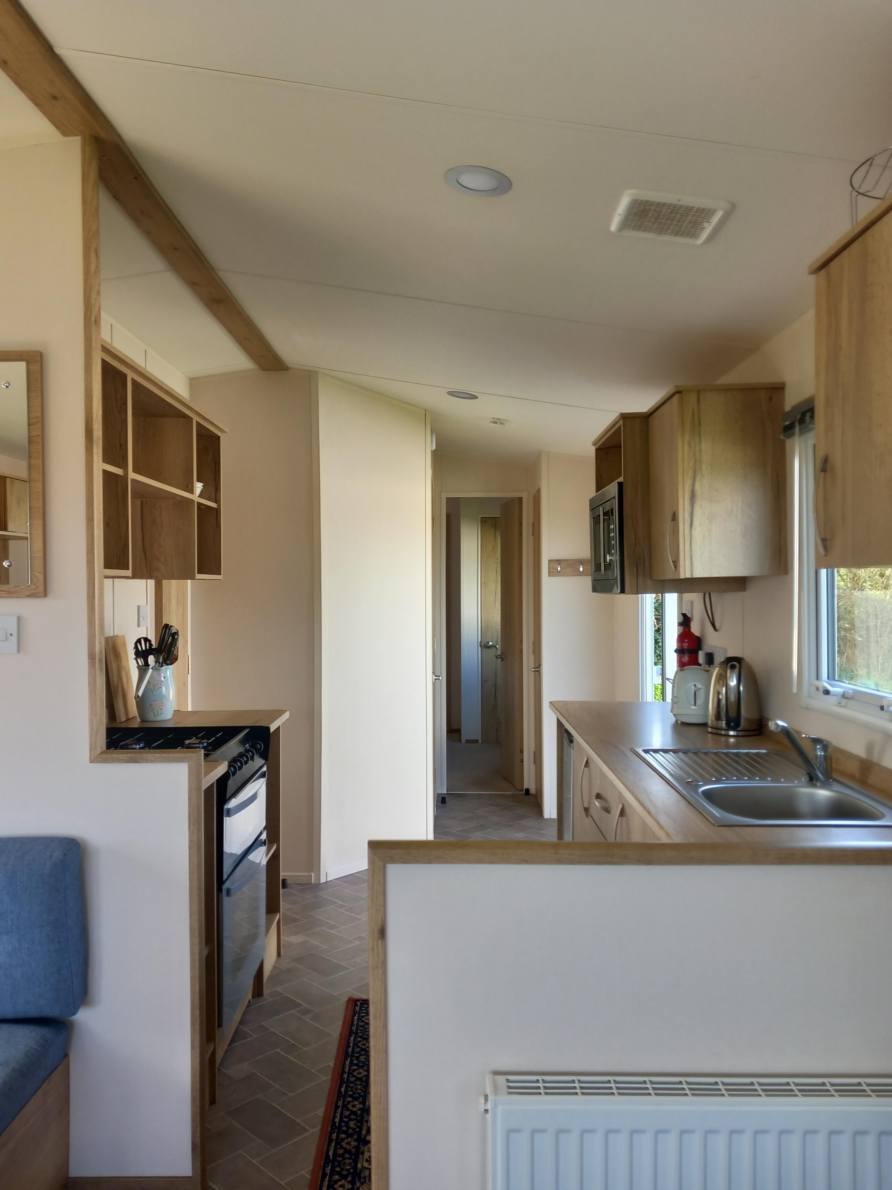 Interior shot of the kitchen and other utilities available in the caravan